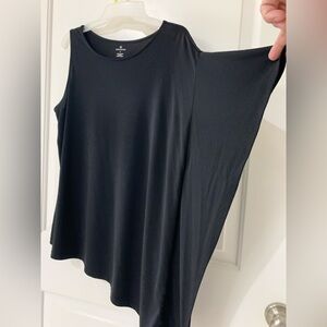 Medium Black Top. Sleeveless on one side, has long material on other side.